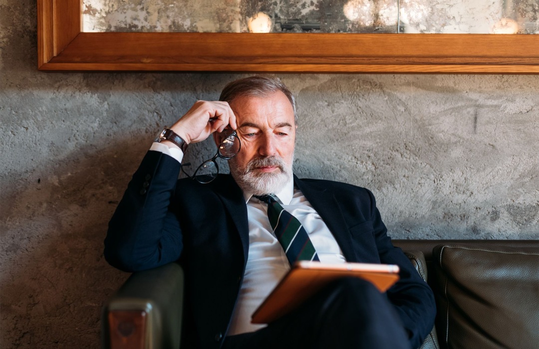 Accounting / Reporting a business man looking at papers