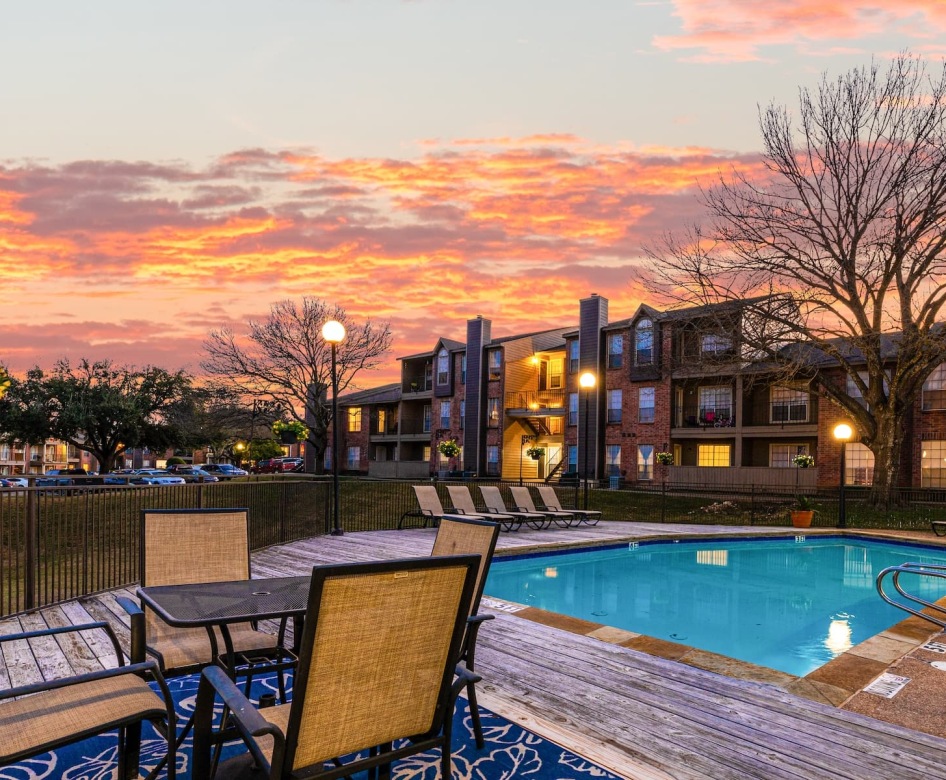 pool with nearby reclining seats and outside courtyard areas